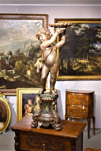 Wooden sculpture depicting a cherub holder